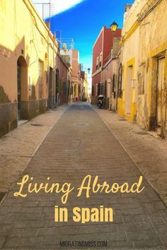 an empty street with the words living abroad in spain