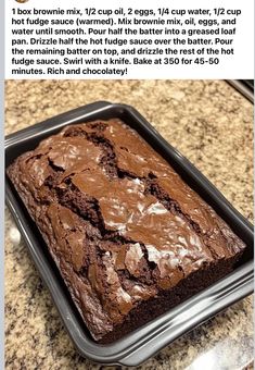 a close up of a cake in a pan on top of a granite countertop