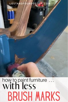 someone is painting furniture with blue paint and brush marks on the bottom part of the chair