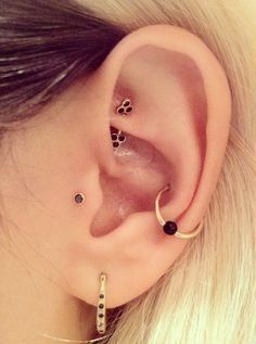 an ear with two piercings attached to it