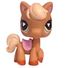 the little pony has big eyes and brown hair