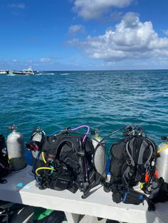 scuba gear sitting on the back of a boat