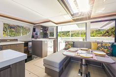 a kitchen and dining area on a boat