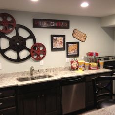 a kitchen area with sink, dishwasher and other items on the counter top