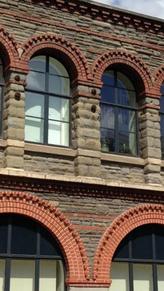 an old brick building with arched windows