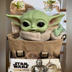 the baby yoda toy is in a bag