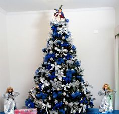 a christmas tree with blue and silver decorations