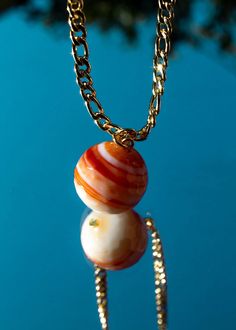 Saturns Orbit Spiritual Agate Gold Jewelry, Gold Carnelian Jewelry For Meditation, Agate Jewelry With Adjustable Chain, Gold Agate Healing Jewelry, Gold Agate Jewelry For Healing, Gold Agate Amulet Necklace, Gold Agate Amulet Necklaces, Gold Amulet Style Agate Necklaces, Yellow Gold Agate Jewelry Gift