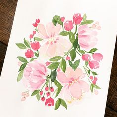 a watercolor painting of pink and red flowers on white paper with green leaves in the center