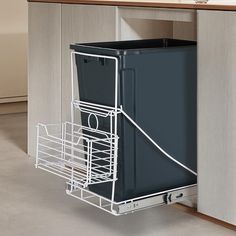 a dishwasher that is in the middle of a cabinet