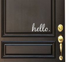 a black door with the word hello written on it