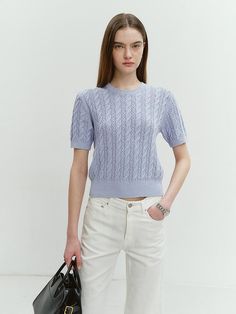 This product is a summer cotton cable knit top that combines traditional knitting techniques with a fresh, modern cut. Its short sleeves and breathable fabric make it ideal for warmer weather, while the cable knit pattern adds texture and visual interest. The top features a relaxed fit, allowing for ease of movement and a laid-back yet refined look. - The top's cotton material provides both comfort and a lightweight feel, perfect for summer days.- Its classic crew neck design keeps the style versatile for both casual and smarter occasions.- The intricate cable knit pattern showcases skilled craftsmanship and adds depth to the garment.- Designed with a cropped length, it pairs effortlessly with high-waisted skirts or pants for a balanced silhouette. Waisted Skirts, Knitting Techniques, Knit Pattern, Summer Cotton, Knit Patterns, Cotton Tops, Neck Designs, Summer Days, Cable Knit