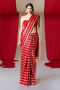 Red silk saree with stripe woven motifs. Comes with unstitched blouse piece. - Aza Fashions Red Cotton Silk Pre-draped Saree With Dupatta, Red Cotton Silk Pre-draped Saree For Designer Wear, Festive Red Cotton Silk Pre-draped Saree, Red Cotton Silk Pre-draped Saree, Red Silk Pre-draped Saree For Traditional Ceremonies, Red Cotton Silk Pre-draped Saree With Cutdana, Red Cotton Silk Pre-draped Saree For Diwali, Red Pre-draped Saree With Unstitched Blouse In Cotton Silk, Red Fitted Raw Silk Pre-draped Saree