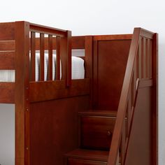 a bunk bed with stairs leading up to it