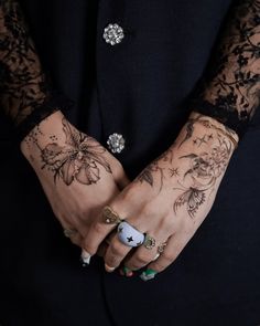 a person with many tattoos on their hands