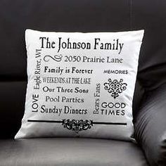 a black and white pillow sitting on top of a couch