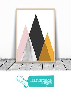 an art print with mountains on it and the words handmade in front of it