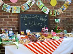 a baby shower is set up with food and decorations