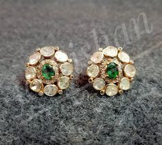 Item- Polki Pave Diamond Emerald Gemstone 925 Sterling Silver Earring Diamond- Pave and Polki Diamond Gross Weight- 10.50gm Earring color- Golden and Black Type- Earring Manufacturing- India Information We are manufacturing all kinds of jewelry. If you have any queries please contact us. We are Happy To Help You. Traditional 17 Jewel Diamond Earrings For Gift, Traditional Diamond White Diamond Earrings As Gift, Traditional Round Cluster Earrings As Gift, Traditional Diamond Cluster Earrings As Gift, Round Hand-set Cluster Earrings As Gift, Green Hand-set Diamond Earrings As Gift, Earring Tops, Tops Gold, Emerald Diamond Earrings