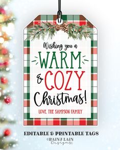 a christmas ornament hanging from a tree with the words warm to cozy christmas on it