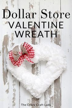 dollar store valentine wreath with red and white plaid bow hanging from it's center