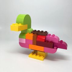 a lego bird made out of different colored blocks