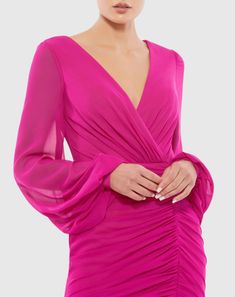 Ieena for Mac Duggal  Chiffon and jersey fabric (100% polyester) Fully lined through body; sheer unlined sleeves Faux wrap v-neckline  Long blouson sleeves  Ruching down front and back of skirt  Concealed back zipper Approx. 33" from top of shoulder to bottom hem Available in Hot Pink Style #A26655 Hot Pink Party Dresses, Classic Cocktail Dress, Rosa Shocking, Vestidos Color Coral, Mode Rose, Plastic Dress, Chiffon Cocktail Dress, Pink Party Dresses, Mac Duggal Dresses