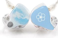 two ear buds with blue and white designs on them