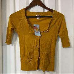 Brand New, With Tags. Mustard Yellow Three Quarter Length Sleeve Cardigan With Pockets. Size Xs, By Mossimo. Yellow Fitted V-neck Cardigan, Yellow Cotton V-neck Sweater, Casual Yellow Cotton Cardigan, Yellow Fitted Casual Cardigan, Fitted Yellow Casual Cardigan, Casual Mustard Cardigan For Spring, Fitted Yellow Cardigan For Fall, Yellow Fitted Trendy Cardigan, Mustard Yellow Cardigan