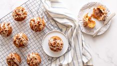 a table topped with pastries on top of a cooling rack