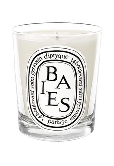 a candle with the words eucaly us on it in black and white lettering