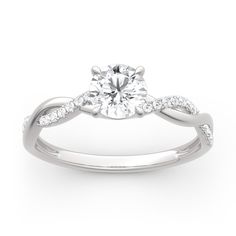 a white gold engagement ring with diamonds on it