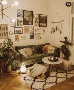 a living room filled with furniture and lots of pictures on the wall above it's coffee table