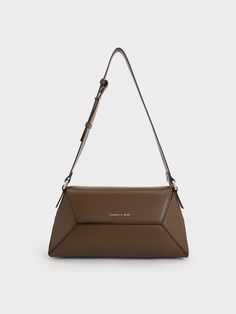 This product is made with at least 20% sustainable materials by weight. CHARLES & KEITH uses recycled, degradable, organic, and water-based materials in our eco-conscious collection.The perfect pick to include in your capsule wardrobe. Our Nasrin shoulder bag in dark brown will complete your look with a moody, dark-academia vibe - it is a great alternative to black. The geometric silhouette and lack of embellishment will appeal to those with a penchant for minimalist styles. Bonus points for the Charts For Kids, Size Chart For Kids, Brown Shoulder Bag, Charles Keith, Wallet Accessories, Printables Kids, Contrast Stitch, Kids Gifts, Belt Size