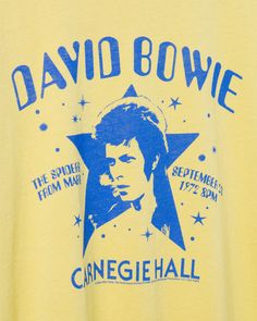 Step into the musical legacy of David Bowie with our Women's David Bowie Carnegie Hall Vintage Tee. Inspired by Bowie's iconic performance at Carnegie Hall, this distressed tee combines vintage charm with timeless rock. Snag a piece of history with a tee that pays homage to a legendary artist and the magic of this live performance. Shop the rest of our Music Collection HERE Bowie Tshirt, Rock Band Tees, Graphic Band Tees, Carnegie Hall, Vintage Band Tees, Distressed Tee, Music Collection, Live Performance, Vintage Rock