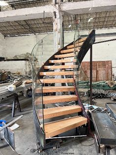 a set of wooden stairs in an unfinished building