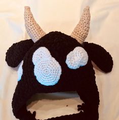 a crocheted hat with horns on it