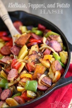 a skillet with sausage, peppers and potato hashbrowns is ready to be eaten