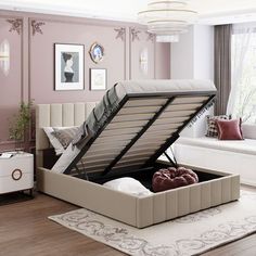 a bed that has been opened and is in the middle of a room with pink walls