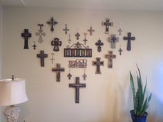 a living room wall with many crosses on it