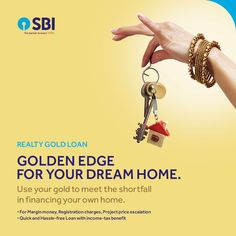 a hand holding a house shaped key with the words realty gold loan on it