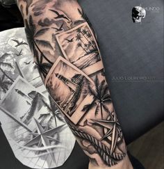 a man's arm with some pictures on it and birds flying over the water