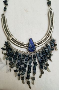 Vintage Peruvian Lapis Silver Bib Style Necklace,, lovely craftsmanship.. each stone is linked with silver wire and a nice Lapis stone inlaid in silver ornate metal is the center pieces.. shorter style necklace.. 15 inches Traditional Silver Necklace With Lapis Lazuli, Elegant Silver Beaded Lapis Lazuli Necklace, Bohemian Blue Lapis Lazuli Beaded Necklace, Silver Bohemian Lapis Lazuli Necklaces, Bohemian Lapis Lazuli Hand-strung Necklace, Polynesian Art, Chip Beads, Coral Blue, Coral Beads