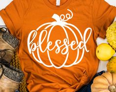 a t - shirt that says, thank pumpkin on it next to other fall items