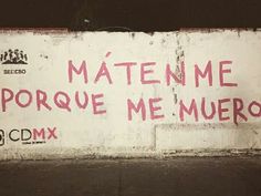 graffiti written on the side of a wall in spanish and english, reads maten me porque me muero