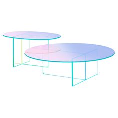 two circular tables sitting next to each other on top of a white table with blue trim