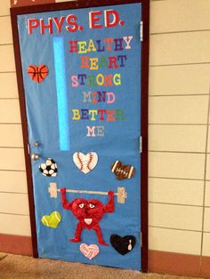 a door decorated with the words phys ed, healthy heart strong mind better me