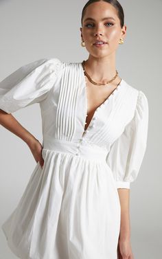 Zandra Puff Sleeve Poplin Mini Dress in White | Showpo USA White Grad Dress, White Dress With Sleeves, Confirmation Dresses, Puffy Sleeve Dress, Spring Maxi Dress, Fabric Buttons, White Long Sleeve Dress, Knot Dress, Mini Handbag