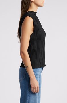 Textured ribs run up and down a lightweight knit top fashioned with extended shoulders and a lettuce-edged boat neck and hem. 22" length (size Medium) Boat neck Sleeveless 100% polyester Dry clean Imported Sleeveless Ribbed Top For Layering, Sleeveless Tops With Ribbing For Layering, Chic Stretch Knit Top With Ribbing, Ribbed Knit Tank Top For Layering, Chic Stretch Ribbed Knit Top, Fitted Knit Top With Ribbed Neckline For Layering, Stretch Knit Top With Ribbing, Sleeveless Fitted Top With Ribbed Neckline, Fitted Sleeveless Top With Ribbed Neckline