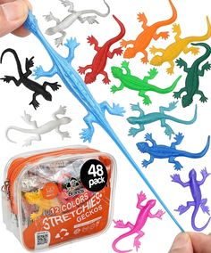 assorted plastic geckos and sticks in a bag